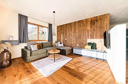 Útulná rohová pohovka v rekreacním apartmánu Gipfelglück